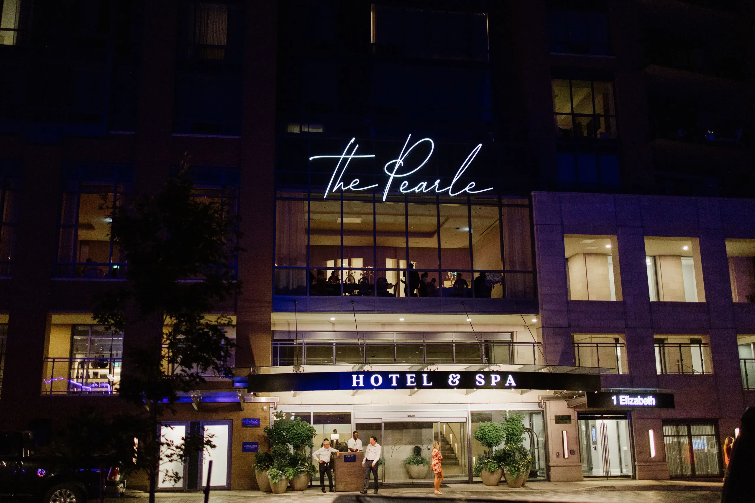exterior of the pearle hotel and spa at night